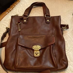 Fossil purse with matching wallet. Carried once. Very good condition.